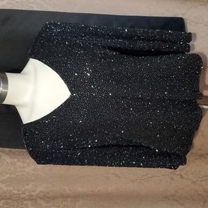 Beautiful long skirt and embellished  black top with small shoulder pads.